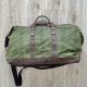 Duża torba podróżna ze skóry i bawełny woskowanej zielono-brązowa w stylu Vintage.