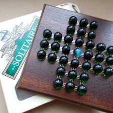 Puzzle dla 1 gracza        Solitaire house od marbles