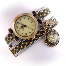 Zegarek- bransoletka w kolorach złotym, czarnym i srebrnym z zawieszkami