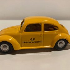 Metalowy VW Garbus Deutsche Post żółty