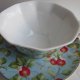 Duża -herbaciana - filiżanka porcelanowa ze spodkiem  - oryginalna forma - wykwintne ucho - smakowite zdobienie