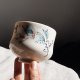 Porcelanowa czarka do herbaty, ręcznie malowana, turkusowe motywy roślinne