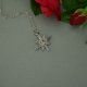 Mały wisiorek róża wiatrów kryształ górski, wire wrapping, stal chirurgiczna
