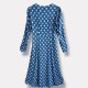 An amazing vintage boho dress with puff sleeves and classic white polka dots