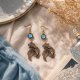 Złote kolczyki Koi z błękitnym oczkiem – unikat handmade