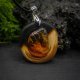 Naszyjnik "Magia Bursztynu" – żywioł ognia i bursztynowego światła, octowiec, pirografia, Amber and Wood Pendant, biżuteria z drewna