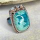 Srebrny pierścień z turkusem w kwiatowej oprawie a1132