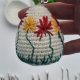 Ręcznie robiona PISANKA na szydełku - BRELOCZEK z haftowanymi kwiatami - ozdoba wielkanocna handmade