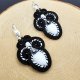 Czarno-białe kolczyki sutasz