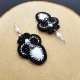 Czarno-białe kolczyki sutasz