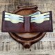 Ręcznie szyty portfel męski ze skóry garbowanej roślinnie.