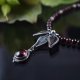 Garnet beauty - srebrny naszyjnik z granatami i srebrnym kwiatem