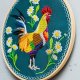Kogut w stokrotkach - zielone tło, haft w tamborku 20 cm