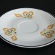 Porcelanowa filiżanka ze spodkiem, Włocławek, pomarańczowo-zielona dekoracja, PRL