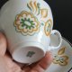 Porcelanowa filiżanka ze spodkiem, Włocławek, pomarańczowo-zielona dekoracja, PRL