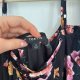 Czarna bluzka w kwiaty Torrid 4 (8-9XL) cold shoulder z wiązaniem 8XL / 56 / 28