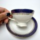 Filiżanka ze spodkiem Haas & Czjzek Bohemia 1900–1945 kobalt złocenia stara cienka porcelana (2/3)