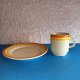 Kubek & talerzyk Lubiana w żółto-pomarańczowych barwach - stan idealny