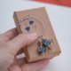 Asymetryczne boho kolczyki, duże koła z kamieniami i ceramiką