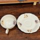 Filiżanka ze spodkiem Spenzo S. Polak & Sons – powój, złocenia, porcelana vintage