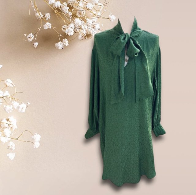 A stunning vintage ribbon 100% viscose dress in a deep, bottle-green hue
