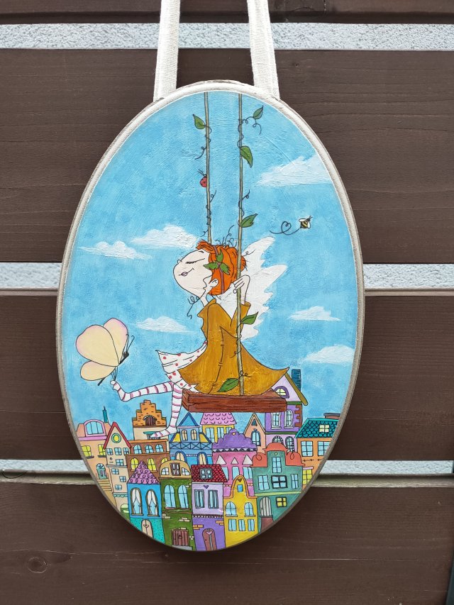 Obraz wróżka nad miastem