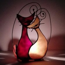 Świecznik brązowy z kotami