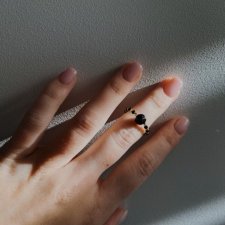 Black and gold ring