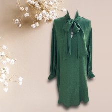 A stunning vintage ribbon 100% viscose dress in a deep, bottle-green hue